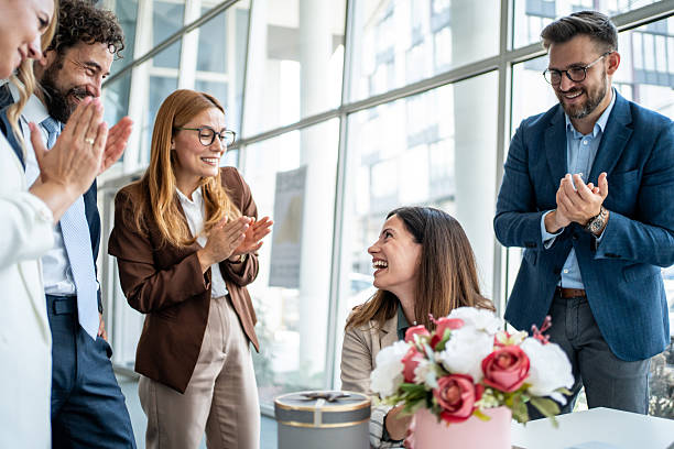 istock Business colleagues celebrating a successful project and giving a gift 2241165542