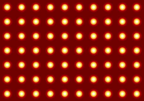 Gold light bulbs seamless pattern. Glowing LED spotlight repeating on red background. Sparkle floodlights surface for wrapping papers, cards, invitations, wallpapers, backdrop, tiles, textiles.