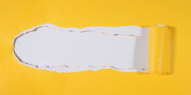 istock Greeting card, festive abstract texture postcard frame template - Torn paper hole in yellow paper with curled rolled edges, white empty background 2241167277