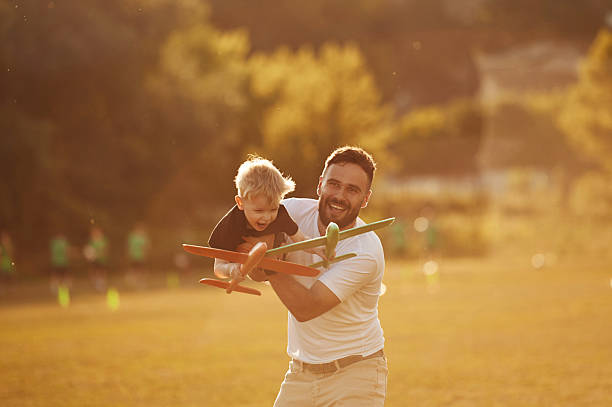 istock Happy father with son on the field 2241172082