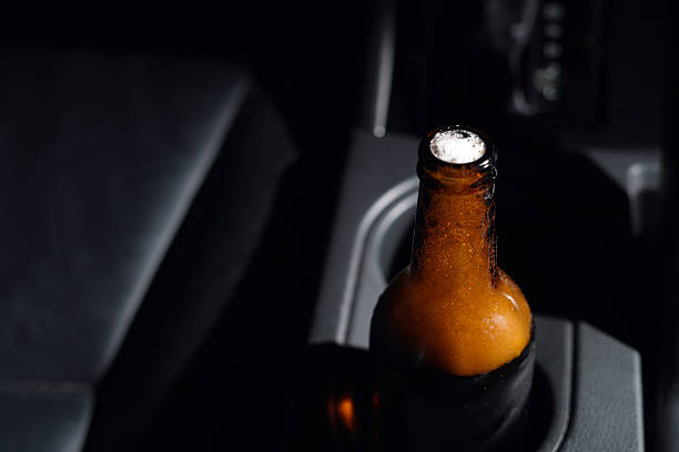 istock Drinking beer in a car is dangerous for drivers. 2241179937