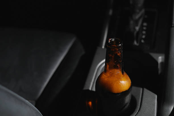 istock Drinking beer in a car is dangerous for drivers. 2241179975