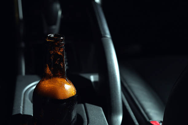 istock Drinking beer in a car is dangerous for drivers. 2241180014