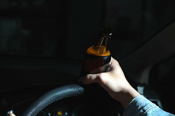 istock Drinking beer in a car is dangerous for drivers. 2241180119