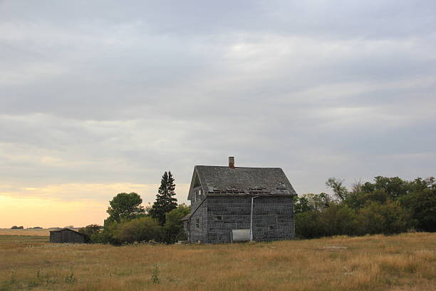 istock Abandoned Farm Yard and Prairie Scenery 2241180194