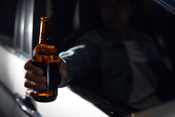istock Drinking beer in a car is dangerous for drivers. 2241180479