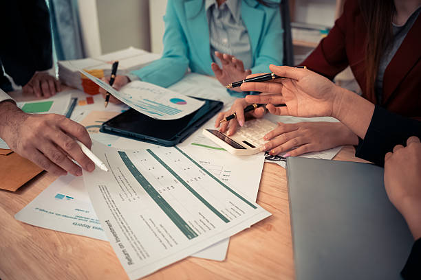 istock Data analysis meeting with business team using laptops and digital charts for strategic planning. With digital tablets and business graphs with data working in the office. 2241181899