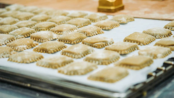 istock Homemade Fresh Ravioli Dough Squares Arranged Uniformly on a Baking Sheet Ready for Cooking or Baking 2241183346