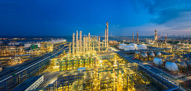 istock Panoramic view of a sprawling coastal oil refinery and industrial complex at night. 2241183849
