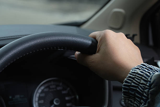 istock Man is driving safely on the road 2241185026