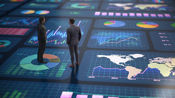 istock Business professionals analyze data on digital screens in a modern office setting during a meeting focused on performance metrics 2241185722