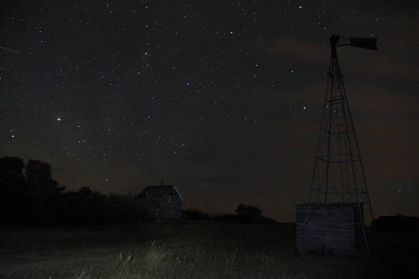 istock Stars and Clouds over an Abandoned Farm 2241186085