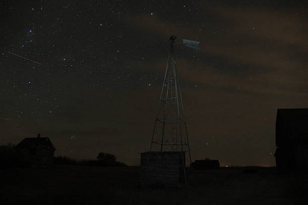 istock Stars and Clouds over an Abandoned Farm 2241186092