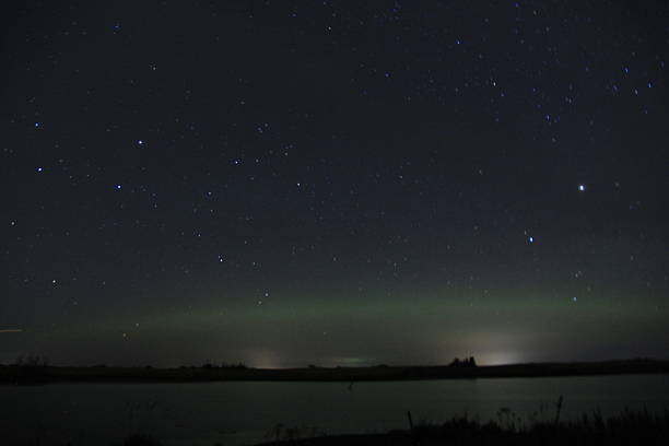 istock Aurora over an abandoned church and water. 2241186260