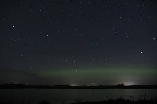 istock Aurora over an abandoned church and water. 2241186263