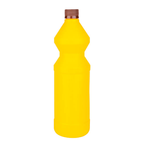 yellow bottle with brown cap on isolated white background