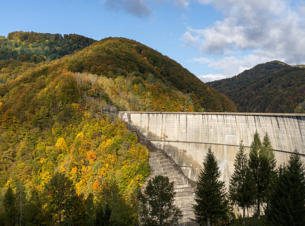 istock the dam and the autumn forest 2241187757