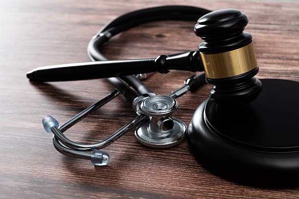 istock Gavel and stethoscope on wooden table 2241189346