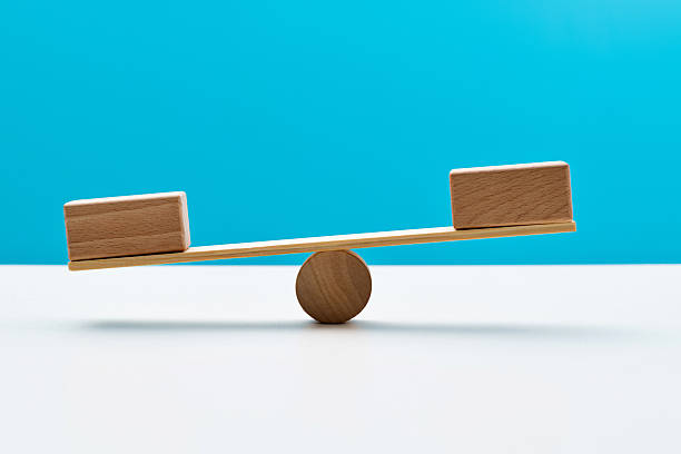 istock Blank blocks on wooden seesaw 2241189451