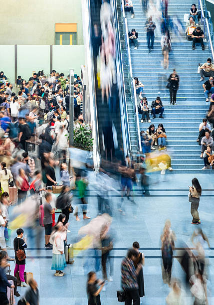 istock Crowd of passengers walking at railroad station 2241189578