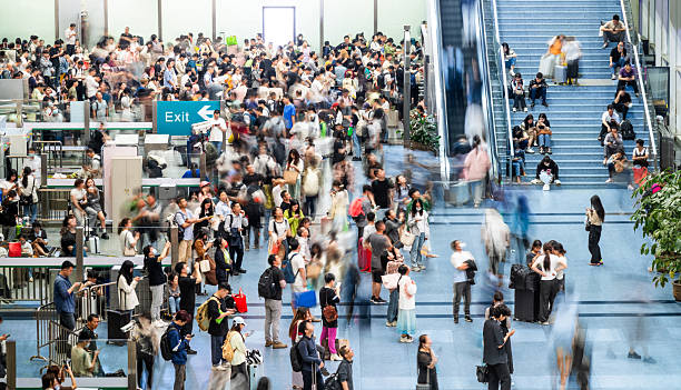 Crowd of passengers walking at railroad station