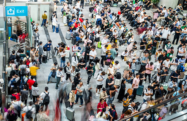 istock Crowd of people waiting for a train at train station 2241189633