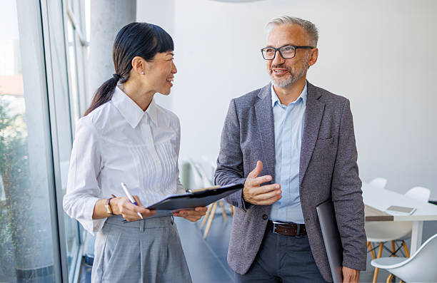 istock Business colleagues discussing project ideas in modern office 2241191020