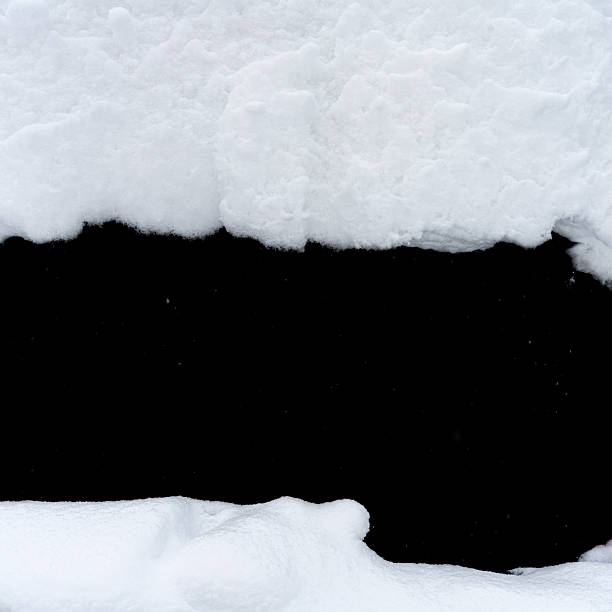 istock Natural snow isolated on black background 2241192740