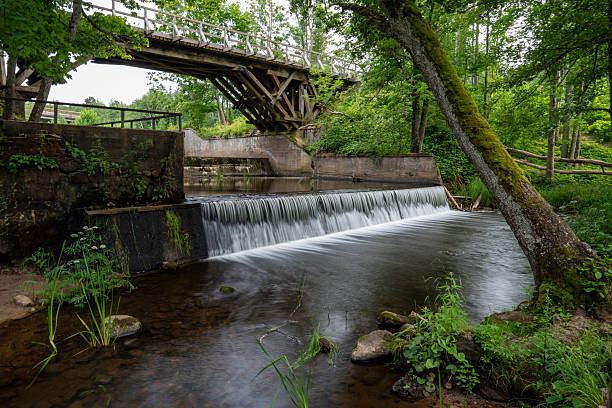 istock A Serene and Beautiful River Scene Nestled Beneath a Rustic Wooden Bridge Overlooking Nature 2241193036