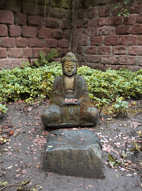 Buddha sculpture at Japanischer Garten (Japanese Garden) during a summer season in Kaiserslautern, Germany.