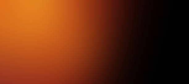 istock Abstract Yellow Orange and Black Gradations with Noise 2241196740