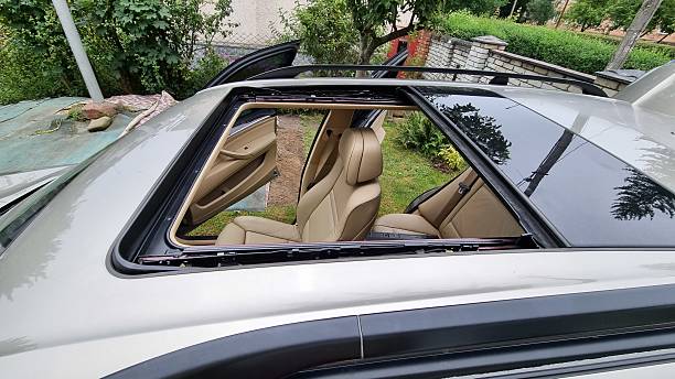 istock Open panoramic sunroof on car roof 2241197612