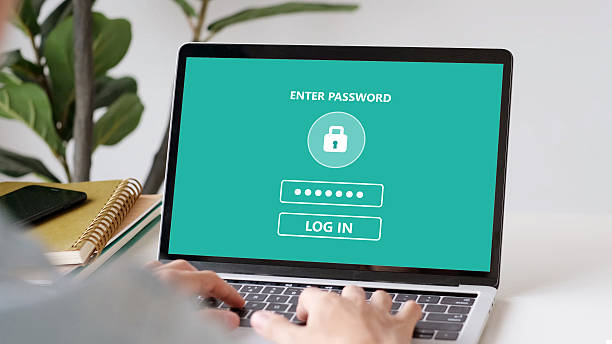 istock Hand tying laptop computer with password login on screen, cyber security concept 2241201865