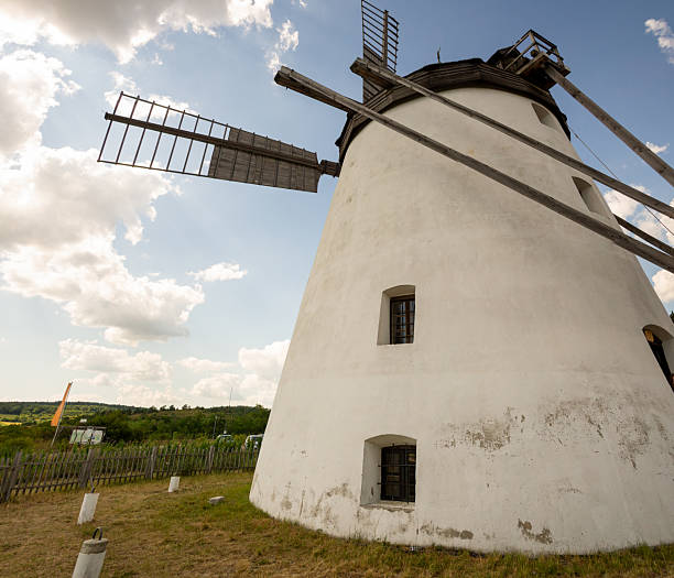 istock Panorama of a windmill with clouds in the background 2241205822