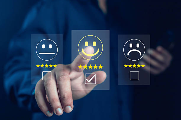 istock Customer satisfaction concept showing hand choosing happy smile face with five stars on virtual screen, representing positive feedback, online review, quality service, and user experience improvement. 2241206049