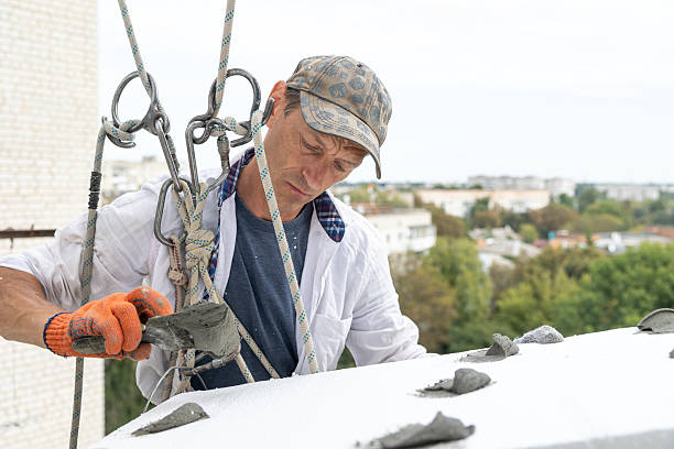 atlantic ocean, underway, on board ship - march 29, 2025 : wielder with his assistant repairing water draining channel bar on the cargo hold cover