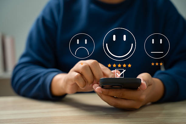 istock Customer satisfaction survey concept, Businessman using smartphone touch happy smiley icon, 5 star service experience rating, Feedback, Online review, Online application, Quality satisfaction review. 2241208026