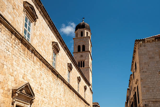 istock Limestone campanile and stone facade 2241209517