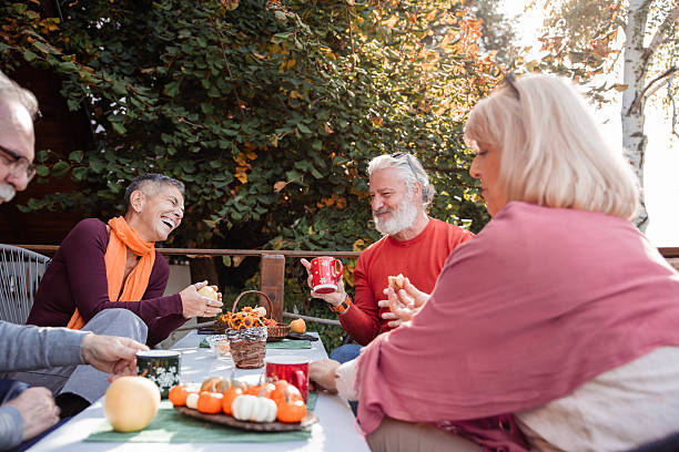 istock Seniors socializing on the terrace 2241209579