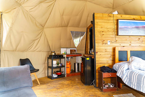 istock Glamping dome tent interior featuring kitchenette and bedroom 2241212098