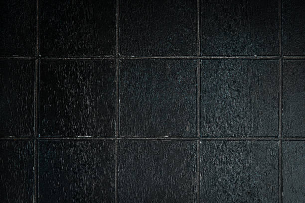 istock Black stone background with imitation tiles. Top view. Free space for text or design. 2241213206
