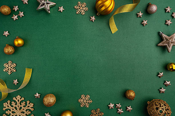 istock Gold and Green Christmas Ornaments Frame on Green Background 2241214279