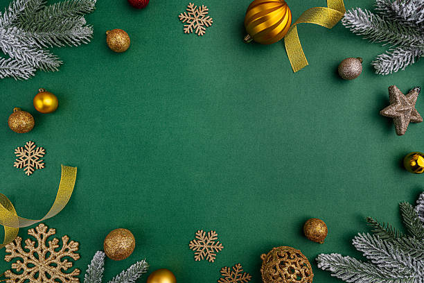 istock Gold and Green Christmas Ornaments Frame on Green Background 2241214295