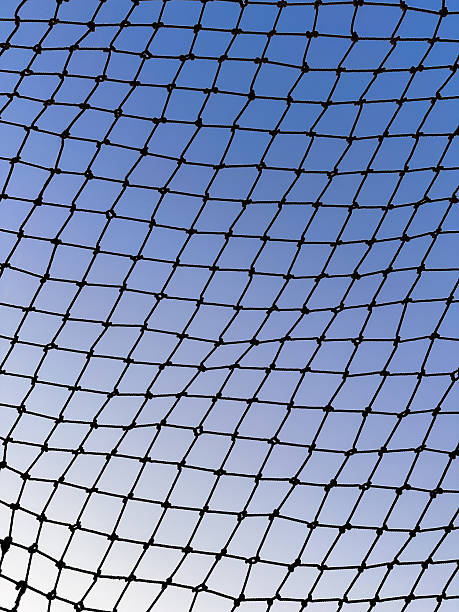 istock Mesh Sky. Geometric Net Against Blue Sky 2241214760