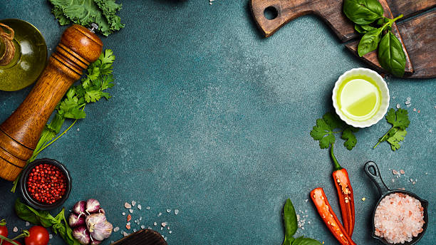 istock Stone black cooking background. Kitchen board with vegetables and spices. On a black stone background. Top view 2241214802