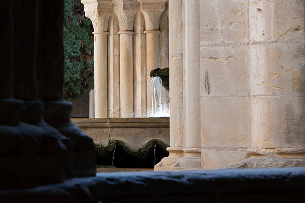 Columns and fountains in a Gothic-style courtyard.Santa Maria de Poblet Monastery.Tarragona