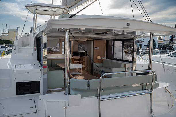 istock Contemporary catamaran exterior and interior with an open living space featuring light green cushioned seating 2241220846