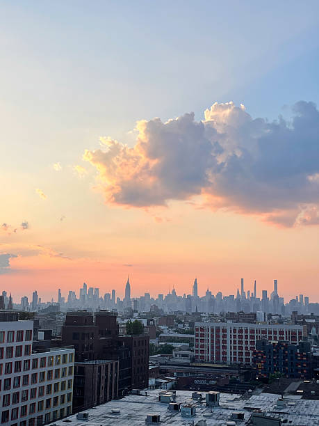 istock Pink clouds over NYC skyline at golden hour 2241228288