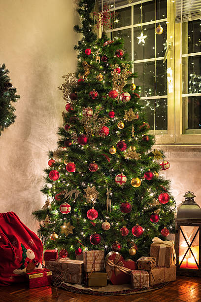 istock Christmas tree with presents in the living room 2241228737