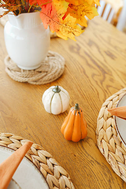 istock Autumn table setting with pumpkins and fall leaves in a vase 2241230697